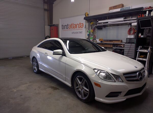 White Mercedes-Benz E-Class Coupe with professional window tinting Woodstock